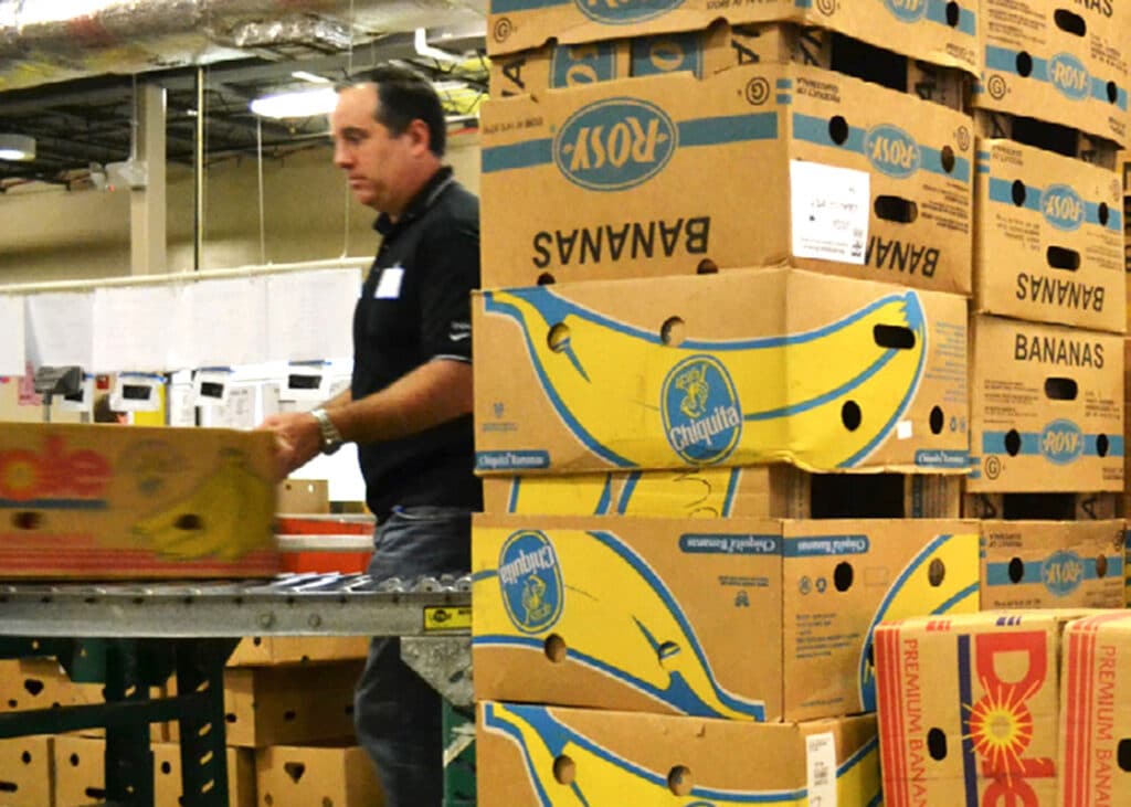 How do you safely handle hundreds of banana boxes full of groceries?